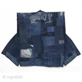 This is an antique boro sodenashi, or sleeveless vest. The intricately patched inside of this vest is what makes this piece truly unique. The inside back is made of a composite of  ...