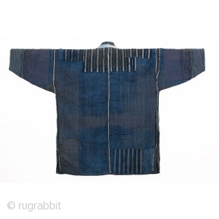 This is an antique Japanese boro farmer's workwear jacket called a noragi. 

The textile is made of hand spun cotton which has been dyed in natural, botanical indigo and woven into a  ...