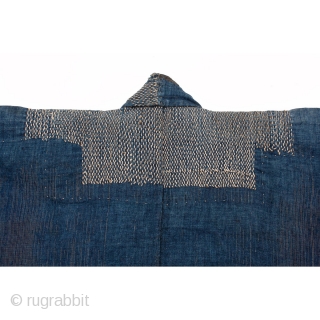 This is an antique Japanese boro farmer's workwear jacket called a noragi. 

The textile is made of hand spun cotton which has been dyed in natural, botanical indigo and woven into a  ...