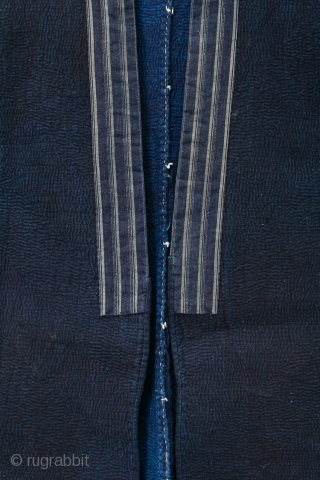 This is a Japanese sashiko noragi, or quilted coat, from Shonai, Yamagata prefecture of Japan. 

This jacket's entire surface is dyed with a deep natural indigo and is densely sashiko stitched. The  ...