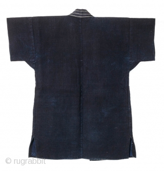 This is a Japanese sashiko noragi, or quilted coat, from Shonai, Yamagata prefecture of Japan. 

This jacket's entire surface is dyed with a deep natural indigo and is densely sashiko stitched. The  ...