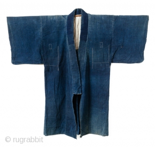 This is a large Japanese indigo dyed jacket, or hanten, decorated with a rice paste resist dye technique. It is very likely that a stencil was used though the appearance has an  ...