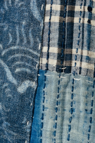 This is a stunning example of an antique Japanese boro futonji with many patches and thousands of sashiko stitches. 

Both sides of this boro are equally impressive. The first and second photographs  ...