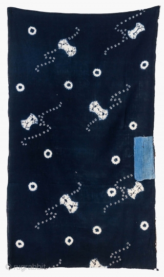 This is a vintage Japanese cotton textile fragment decorated with mixed shibori tie-dye techniques of kanoko (spaced dots), boshi (capped circles), and shapes, perhaps of fundo weights. The pattern is relaxed and  ...