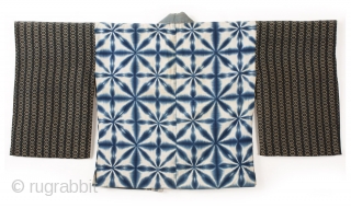 This is a striking shibori dyed han juban, which is often worn underneath a kimono. Shibori is a Japanese dying technique where patterns are made by binding, stiching, folding, twisting, and compressing  ...