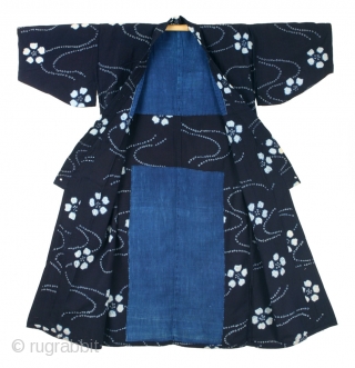 This is a stunning and beautifully constructed long shibori work coat, or nagagi, from the Tohoku region of Japan. 


This particular shibori style - crystal whites against deep botanical indigo - is  ...