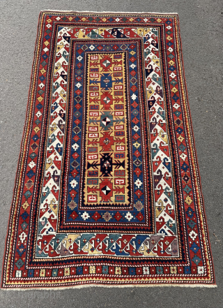 Antique Kazak rug. 19th century. This rug has a good design and particularly good colours. Minor edge repairs..               