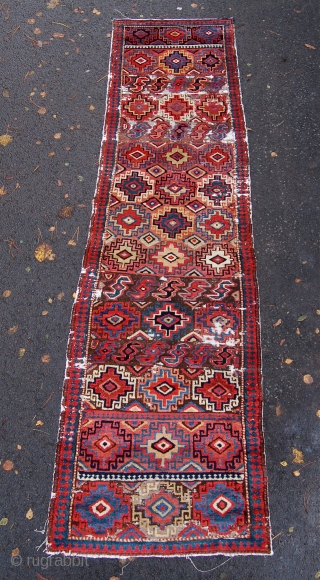 Unusual north west persian runner. Probably shashavan, possibly third quarter of the 19th century. Beautiful colours and lovely wool. Some wear and moth damage. 287 x 74cm.      