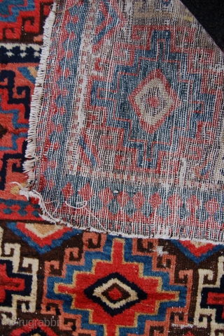 Unusual north west persian runner. Probably shashavan, possibly third quarter of the 19th century. Beautiful colours and lovely wool. Some wear and moth damage. 287 x 74cm.      