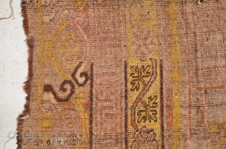 Khotan circa 1900 fragments. faded fuchsine ground.
Size is 366 x 218 cm or 12ft x 7.2 ft                