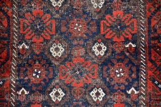 Baluch rug 1910, size is 185 x 103 cm, overall fair condition, black is too worn but flowers are in good condition. a good example of baluch.      