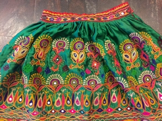 kutchi rabari child skirt hand embroided on satin silk from makhana village in kutch region gujarat the skirt is having beautiful hand embroided design of peacocks and flowers with beautiful base of  ...