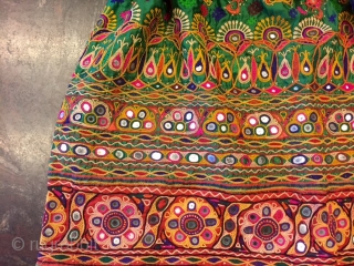 kutchi rabari child skirt hand embroided on satin silk from makhana village in kutch region gujarat the skirt is having beautiful hand embroided design of peacocks and flowers with beautiful base of  ...