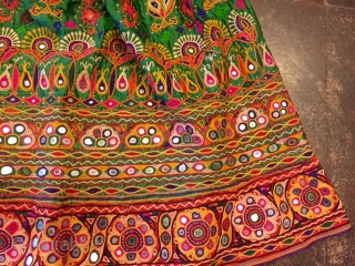 kutchi rabari child skirt hand embroided on satin silk from makhana village in kutch region gujarat the skirt is having beautiful hand embroided design of peacocks and flowers with beautiful base of  ...