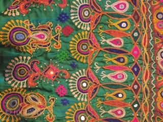 kutchi rabari child skirt hand embroided on satin silk from makhana village in kutch region gujarat the skirt is having beautiful hand embroided design of peacocks and flowers with beautiful base of  ...