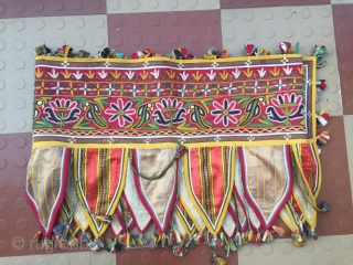 Rabari Mochi hand embroidered   long Toran  from bhujodi village Kutch region Gujarat with very fine work with vegetables dyes the size of the Toran is 112 inch X 18  ...