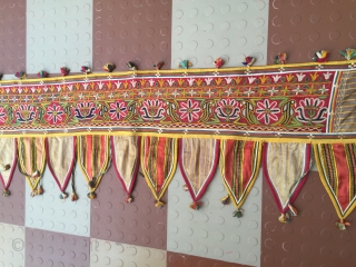 Rabari Mochi hand embroidered   long Toran  from bhujodi village Kutch region Gujarat with very fine work with vegetables dyes the size of the Toran is 112 inch X 18  ...