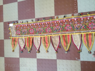 Rabari Mochi hand embroidered   long Toran  from bhujodi village Kutch region Gujarat with very fine work with vegetables dyes the size of the Toran is 112 inch X 18  ...