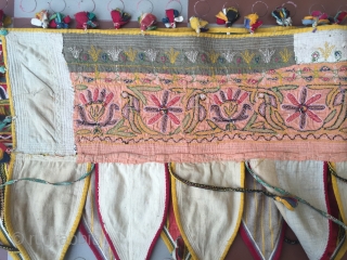 Rabari Mochi hand embroidered   long Toran  from bhujodi village Kutch region Gujarat with very fine work with vegetables dyes the size of the Toran is 112 inch X 18  ...