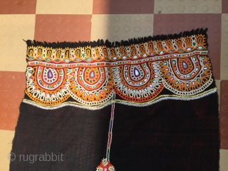 This is kutchi Rabari brides head cloth from bhavanipar Kutch region Gujarat the raw wool shawl is embroided with looped stich work.the raw woollen ground with the and dyed element that mirror  ...