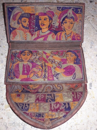 Rugrabbit note: this is not 18th century but a contemporary reproduction/ fake.




18th century mochi hand embroided leather purse from jadeja family from kutch gujarat with its very very fine intricate embroidery work  ...