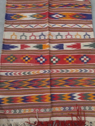 Durrie handwoven of cotton with vibrant colours with geometrical design all over from Thar desert region of Rajasthan India.the durrie is in very find condition without any holes or stains.the size of  ...