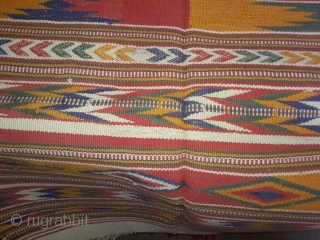 Durrie handwoven of cotton with vibrant colours with geometrical design all over from Thar desert region of Rajasthan India.the durrie is in very find condition without any holes or stains.the size of  ...