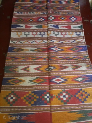 Durrie handwoven of cotton with vibrant colours with geometrical design all over from Thar desert region of Rajasthan India.the durrie is in very find condition without any holes or stains.the size of  ...