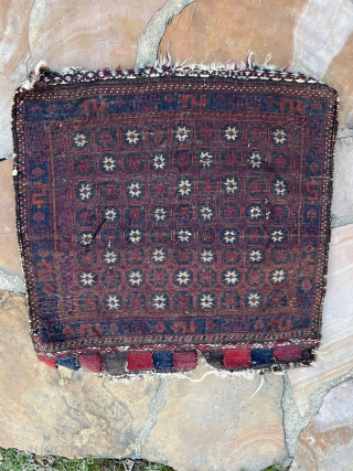 A checkerboard star design Baluch bag face that measures 26 x 26 IN in size and was woven circa 1900.  This piece is in overall great full pile condition.  there  ...