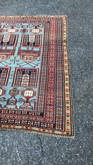  This is an antique Tachte Shirvan rug woven during the last quarter of the 19th century circa 1880. It has a rare powder blue background color with an even more rare  ...