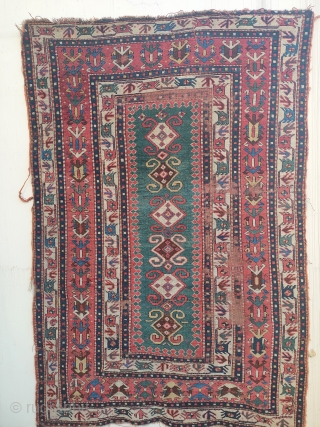 early tribal kazak with white ground bird-borders and great colours. 2 main areas of wear, on the right side and at the top of the narrow green field. no restorations apart of  ...