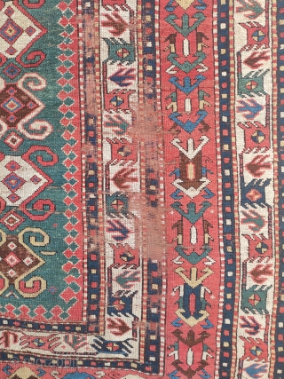 early tribal kazak with white ground bird-borders and great colours. 2 main areas of wear, on the right side and at the top of the narrow green field. no restorations apart of  ...