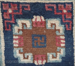 19th century small sized tibetan rug with white border, nice  natural dyes and quite good pile. tibet, approx 110x 65cm.            