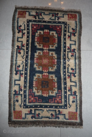 19th century small sized tibetan rug with white border, nice  natural dyes and quite good pile. tibet, approx 110x 65cm.            