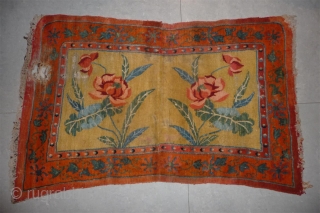 attractive early 20th century yellow ground tibetan under saddle with flamming pearl minor border.                   