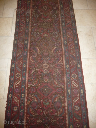 an early north-west persian long rug, possibly kurdish, with a very unusual colour palette, all natural with different purples and light indigo abrash. ends and selvedge partially worn but more or less  ...