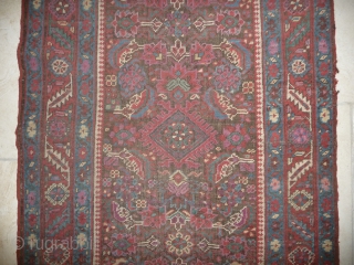 an early north-west persian long rug, possibly kurdish, with a very unusual colour palette, all natural with different purples and light indigo abrash. ends and selvedge partially worn but more or less  ...