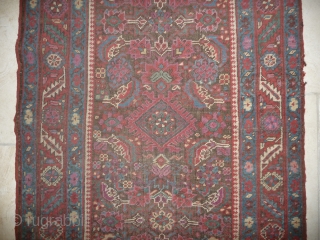 an early north-west persian long rug, possibly kurdish, with a very unusual colour palette, all natural with different purples and light indigo abrash. ends and selvedge partially worn but more or less  ...