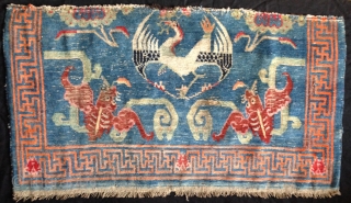 beautiful fragment of an early 20th century tibetan rug of an originally 230x 130cm size. rugs bigger than the common khaden size are not common in tibet.probably a piece made for the  ...