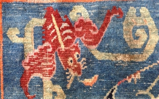 beautiful fragment of an early 20th century tibetan rug of an originally 230x 130cm size. rugs bigger than the common khaden size are not common in tibet.probably a piece made for the  ...