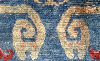 beautiful fragment of an early 20th century tibetan rug of an originally 230x 130cm size. rugs bigger than the common khaden size are not common in tibet.probably a piece made for the  ...