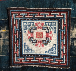 beautiful mid 19th century tibetan square. wonderful natural colors including  strong yellow and greens.a  very happy piece with a not so common white ground..and very good condition    