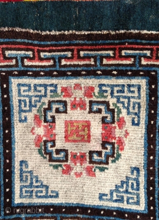 beautiful mid 19th century tibetan square. wonderful natural colors including  strong yellow and greens.a  very happy piece with a not so common white ground..and very good condition    