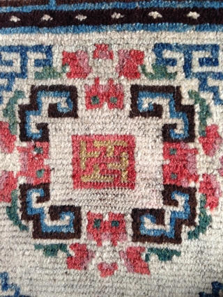 beautiful mid 19th century tibetan square. wonderful natural colors including  strong yellow and greens.a  very happy piece with a not so common white ground..and very good condition    