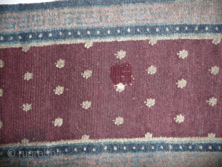 a very old heavy monastic bench cover fragment in monastic purple. the bad restored hole in the middle can be redone very well. 200cm long, thick weave, tibet, around 1800 or before.  ...