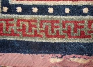 an antique tibetan khaden in superb condition. multicolored lotus flower on a fantastic red background color, beautiful red green border, superb wool and unusual medaillion drawing. the slightly white spot visible on  ...