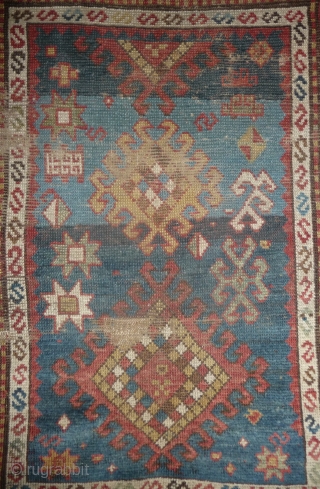 little caucasian rug -110x 95cm- with some wear and missing, but it left quite a lot to decipher. very esthetically made blue field with a well placed abrash in the upper part  ...