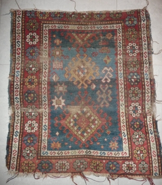 little caucasian rug -110x 95cm- with some wear and missing, but it left quite a lot to decipher. very esthetically made blue field with a well placed abrash in the upper part  ...