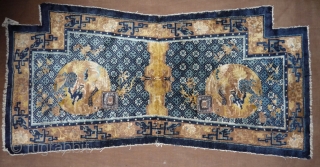 very rare ningxia saddle rug. the roundels are depicting a qilin (the chinese unicorn) and a phoenix. some classical rugs  representing a qilin are known, but this is extremly seldom on  ...