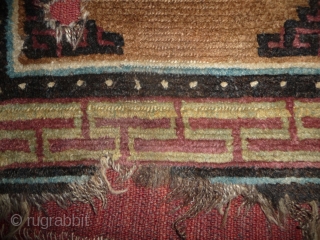 beautiful early tibetan monastic bench cover fragment with floating guls on an empty brown space. lovely patinated old colors, the black color in places is a natural brown overdyed with dark indigo.super  ...